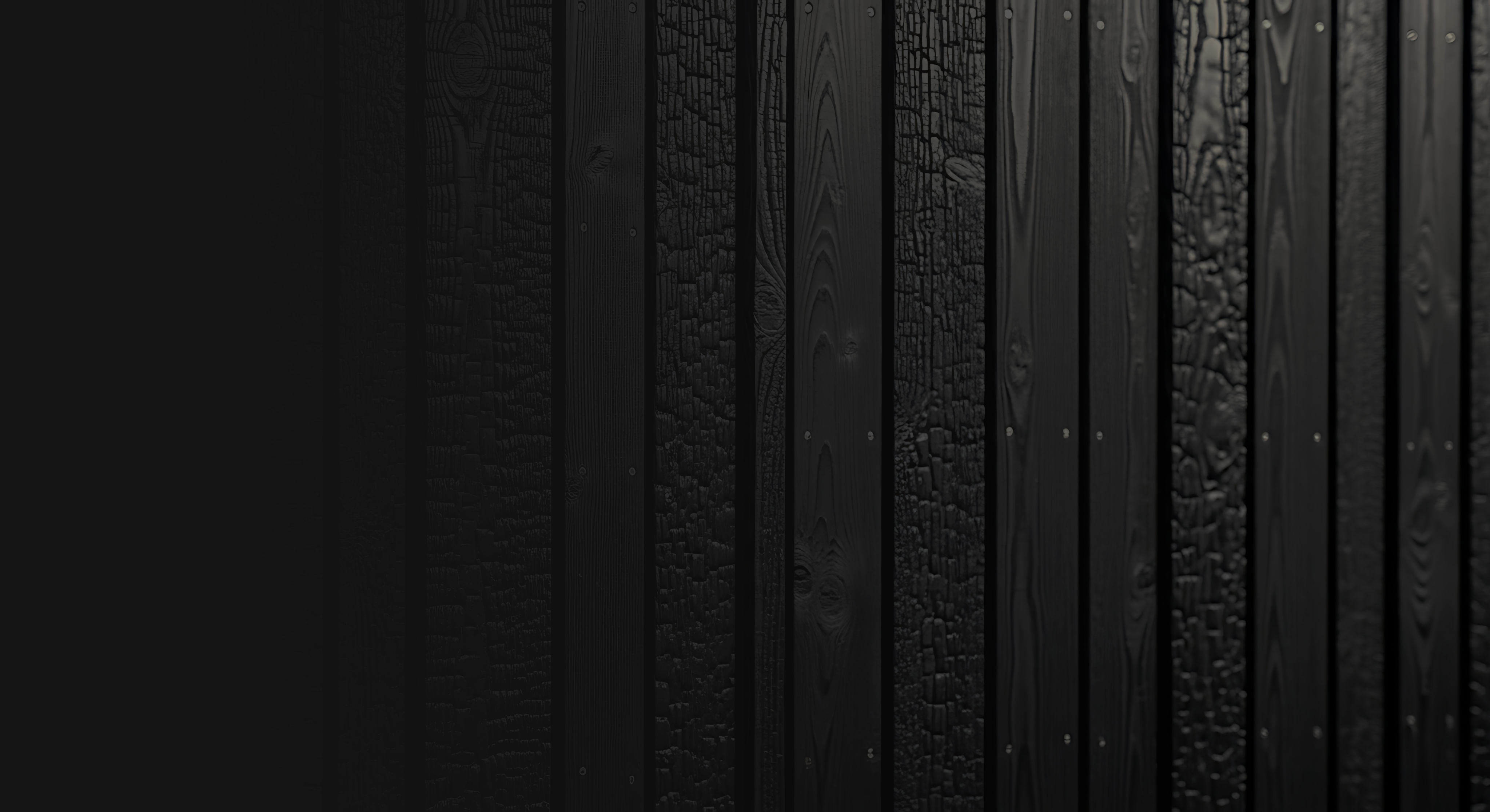 Two women sitting at a modern table talking with a city view behind them.